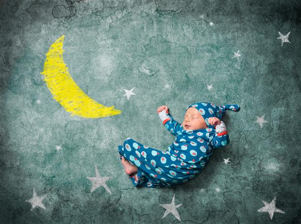 Baby sleeping with stars and moon
